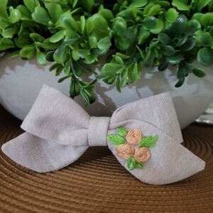 Hand Embroidered hair bow .
